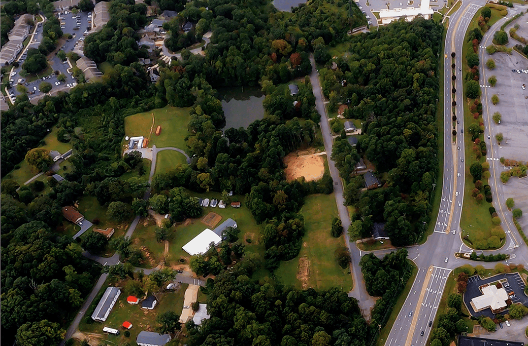 Aerial view of residential areas and green spaces in High Point, NC.